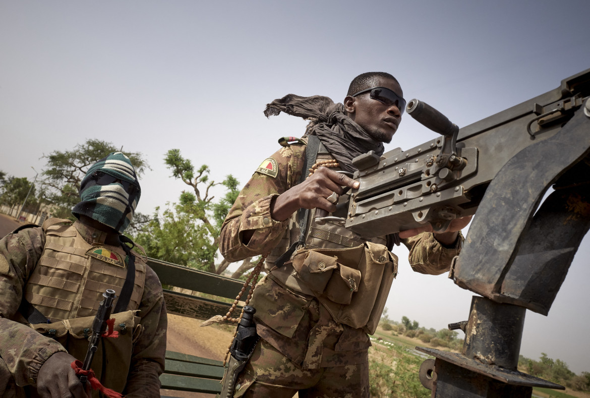 Soldiers of the Malian army are seen during a patrol on the road between Mopti and Djenne, in central Mali, on February 28, 2020. A week earlier Mali's Prime Minister announced the dismantling of the security checkpoints organized by the traditional militia hunters Dan Na Ambassagou from Dogon country. (Photo by MICHELE CATTANI / AFP) (Photo by MICHELE CATTANI/AFP via Getty Images)