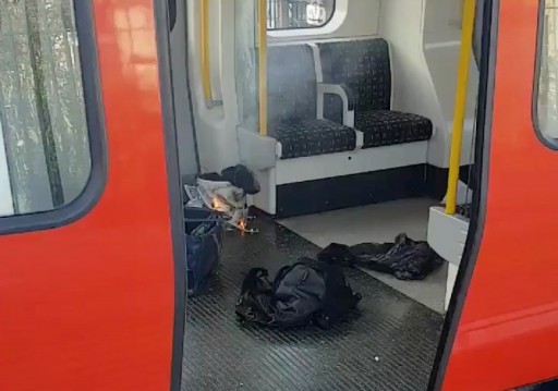 Personal belonglongs and a bucket with an item on fire inside it, are seen on the floor of an underground train carriage at Parsons Green station in West London, Britain September 15, 2017, in this image taken from social media. SYLVAIN PENNEC/via REUTERS THIS IMAGE HAS BEEN SUPPLIED BY A THIRD PARTY. NO RESALES. NO ARCHIVES. MANDATORY CREDIT