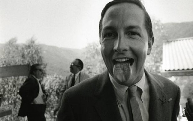 Robert-Rauschenberg-with-his-tongue-stamped-_Wedding-Souvenir-Claes-Oldenburg_-1966-_-Dennis-Hopper-620×388
