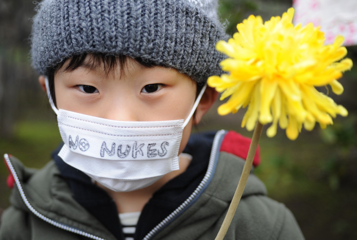 ) -- TOKYO, March 8, 2015 (Xinhua) -- A boy attends an anti nuclear rally in Tokyo, Japan, March 8, 2015. Thousands of people participated in the rally and demonstration ahead of the forth anniversary of the disaster at TEPCO's Fukushima Dai-ichi Nuclear Power Plants. (Xinhua/Stringer)