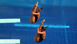 BARCELONA, SPAIN - JULY 20: Tania Cagnotto and Francesca Dallape of Italy compete in the Women's 3m Springboard Synchronised Diving preliminary round on day one of the 15th FINA World Championships at Piscina Municipal de Montjuic on July 20, 2013 in Barcelona, Spain. (Photo by Clive Rose/Getty Images)